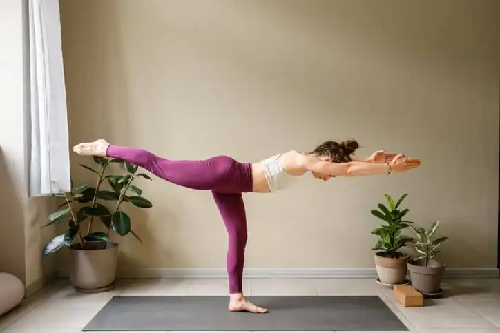 Achieving the Perfect Tone: How Often Should You Exercise for Results? 1 Woman doing Yoga exercise Oxfordshire to help with toning the body.