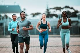 Sculpting Sleek Arms: The Essential Role of Cardio in Toning Without Bulking Up 3 image of people running to incorporate cardio Oxfordshire exercise into their life to help tone arms and body.