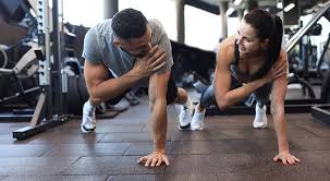Image of man and woman doing Cardio Oxfordshire to tone their arms. 